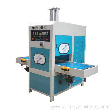 Sliding table high frequency welding and embossing machine